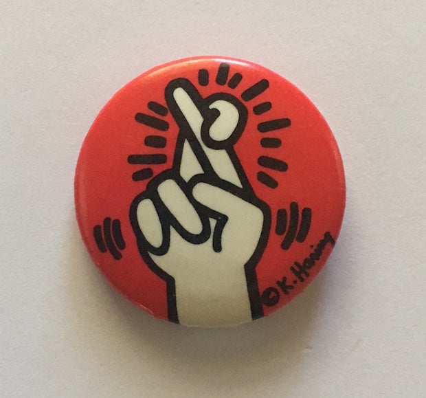 Item #1276 Fingers Crossed Button (circa 1986). Keith Haring.